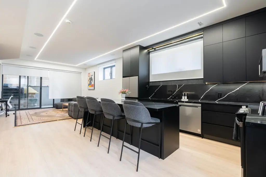 A black marble and metal finished modern kitchen